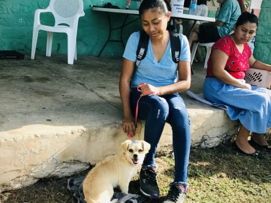 A Belizean and her dog at FVAI's clinic in San Joaquin, Belize