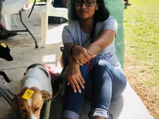 A Belizean and her dog at FVAI's clinic in San Joaquin, Belize